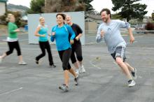 Members of Conrad’s Boot Camp class grin as they work out.